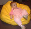 03-01-03_018_Megan_on_yellow_bean_bag.jpg (109283 bytes)