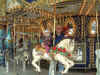 03-04-24_044_Pop_pop_and_Megan_on_carousel.jpg (303917 bytes)